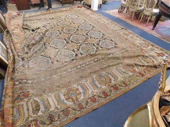 A large Indian carpet, circa 1910, 16ft 1in x 21ft 4in. (652cm x 491cm), fragment 5ft 11in. x 3ft 6in.
